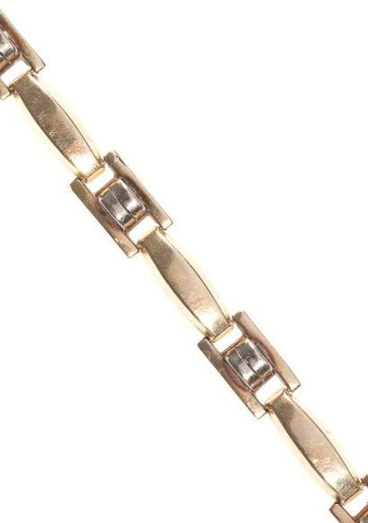 Bracelet articulé en or jaune. Poids: 13,6...