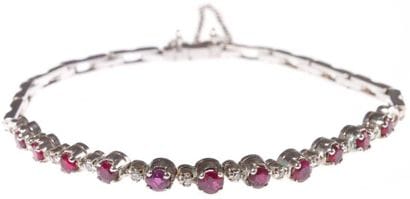 Bracelet articulé en or gris, serti de rubis...