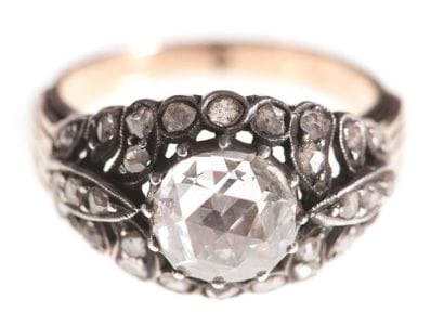 Bague fleur en or (14K) et en argent, ornée...