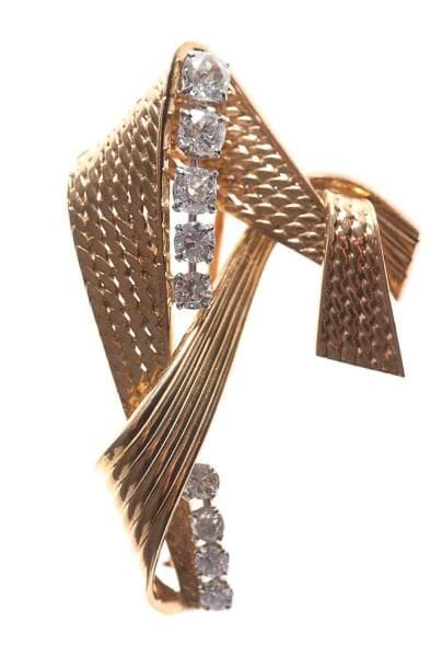 MAUBOUSSIN
Broche-clip ruban d'or jaune godronné...