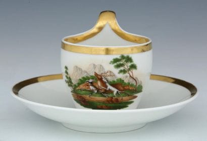 HUNTING CUP and its saucer in white and gold...