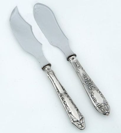 TWO CHEESE KNIFES with silver mounted handles...