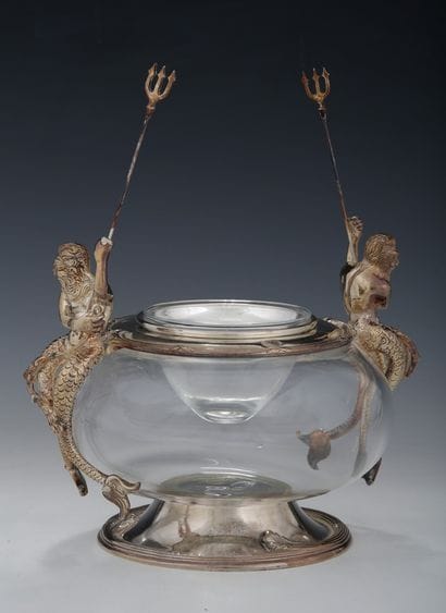 A CAVIAR BOWL in white glass and silver plated...