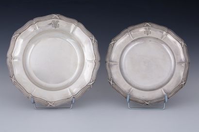 TWO ROUND PLATES of two sizes, one of which...