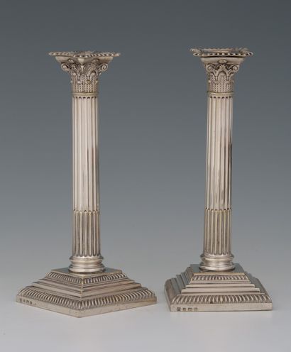 PAIR OF CANDLES in the form of Corinthian...