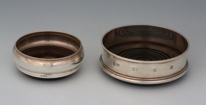 TWO CARAFOLSTER BOTTOMS of two sizes in silver...