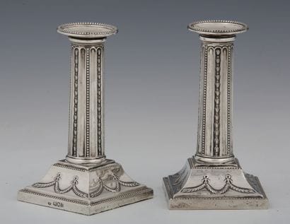 PAIR OF TABLE CANDLES with columnar shaft...