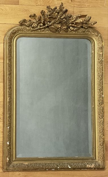 A late 19th century wood and gilded stucco...