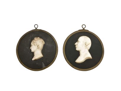 Pair of white marble bas-reliefs on a slate...