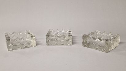 R.LALIQUE - A CANDLESTICK AND TWO ASHTRAYS

Model...
