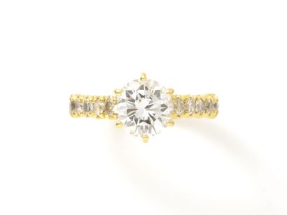 Solitaire ring in gold 750 thousandths decorated...