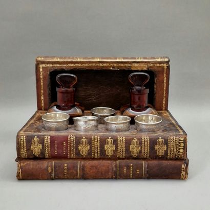 LIQUEUR CELLAR IN THE FORM OF A BOOK STACK...