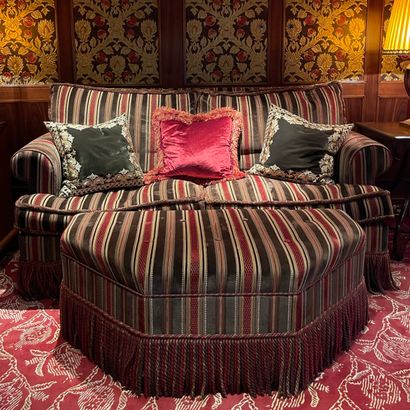 * PENTAGONAL FACADE SOFA AND OTTOMAN in the...