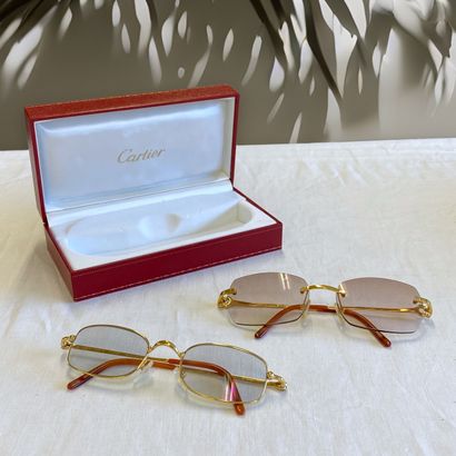 CARTIER - Set of TWO PAIRS OF GOLDEN METAL...