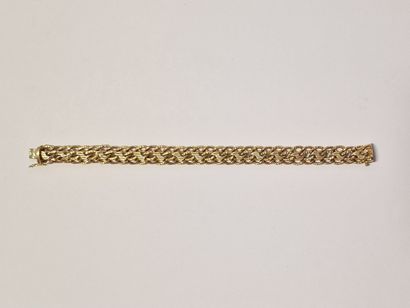 RIBBON BRACELET Circa 1960 in yellow gold...