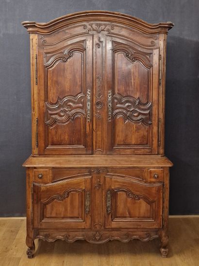 XVIIIth Century, molded and carved fruitwood...