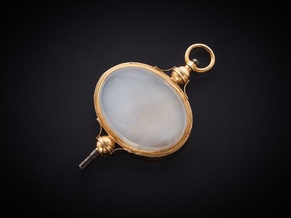 Clef de montre pendentif en or (750 millièmes),...