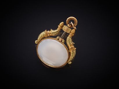 Clef de montre pendentif en or (750 millièmes)...