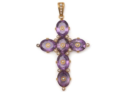 750 thousandths gold PENDANT holding a cross...