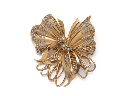 Openwork bow brooch in 750-thousandths gold,...
