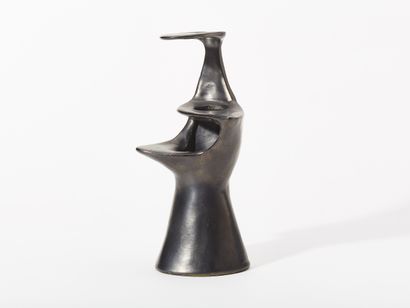 ANONYMOUS 
ORGANIC VASE 
Matte black glazed...