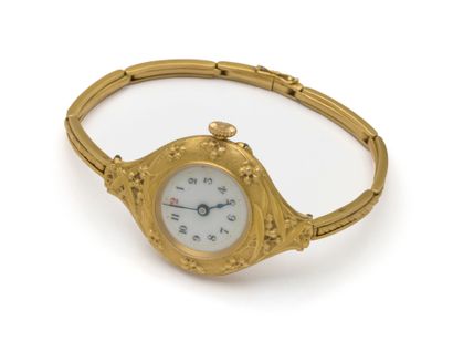 HUGUENIN - MONTRE BRACELET DE DAME en or...