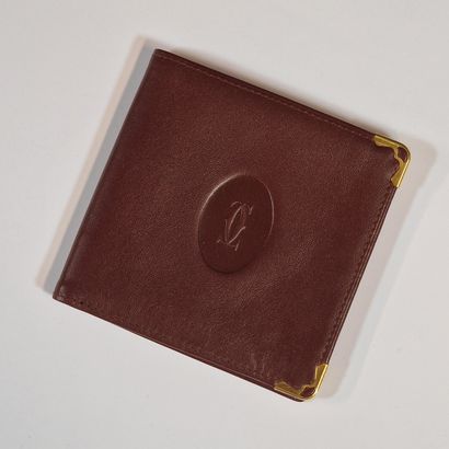 CARTIER - PORTEFEUILLE en veau bordeaux,...