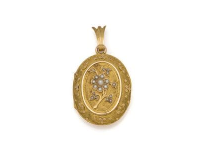 750 thousandths gold PENDANT holding a medallion...