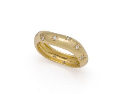 RING in 750-thousandths gold, with star-set...