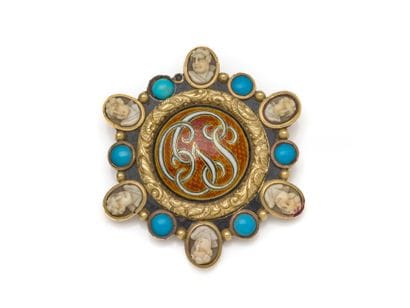 Round, 750 thousandths gold brooch, centered...