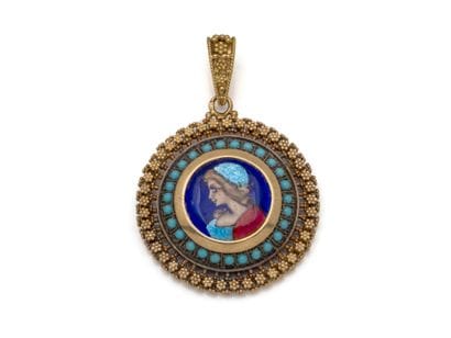 750 thousandths gold pendant holding a medallion...
