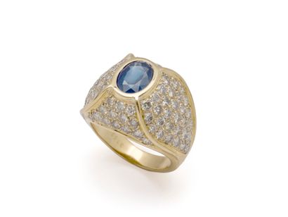 Gold dome ring, set with an oval faceted...