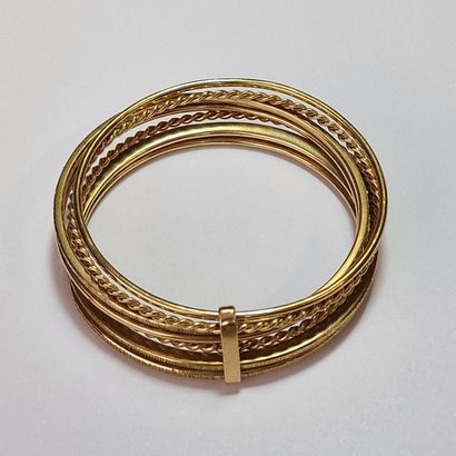 WEEKLY RIGID BRACELET, 20th Century, in yellow...