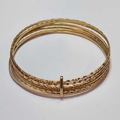XXth CENTURY RIGID BRACELET in yellow gold...