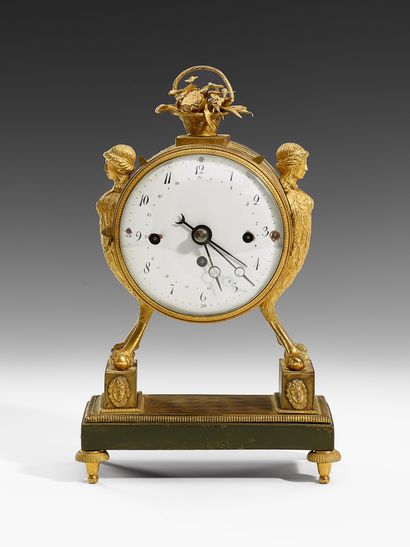 SMALL PENDULE Early 19th Century
Gilt bronze...