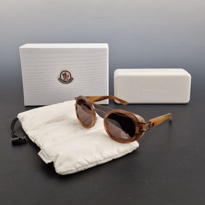 MONCLER - Pair of tortoiseshell resin sunglasses.

Expert...