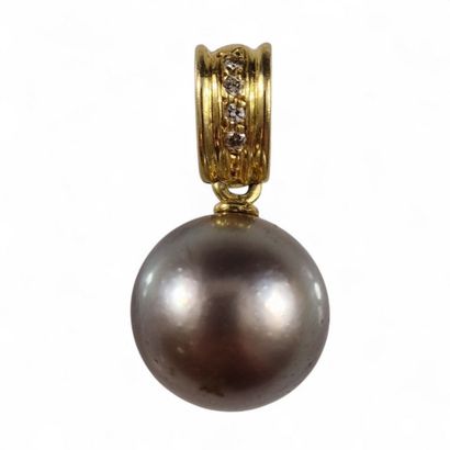 Modern pendant holding a large Tahitian pearl,...