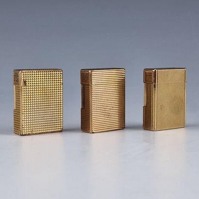 S.T DUPONT PARIS - THREE GOLD-PLATED GAS...