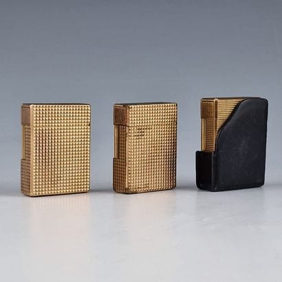 S.T DUPONT PARIS - THREE GOLD-PLATED GAS...
