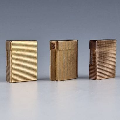 S.T DUPONT PARIS - THREE GOLD-PLATED GAS...