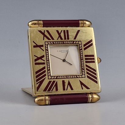 CARTIER - Gilt brass and burgundy composition...