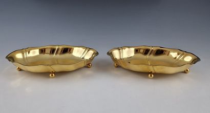 PAIR OF SMALL OVAL CUPS with pinched rims...