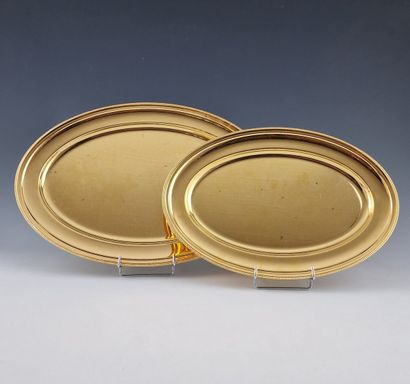 TWO OVAL PLATES OF TWO SIZES in silver- and...