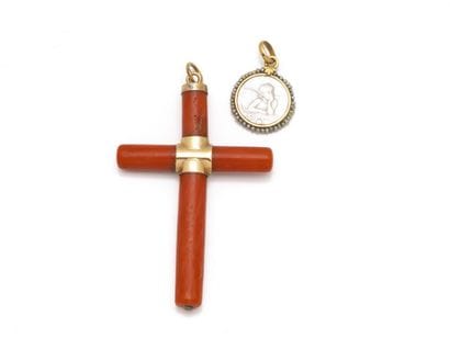 Coral and 750 thousandths gold cross pendant....