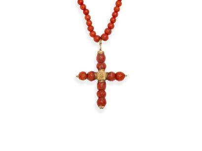 COLLAR composed of a drop of round, faceted...