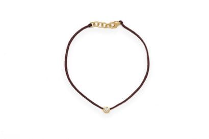 BRACELET composed of a burgundy fabric thread...