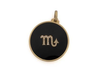 750 thousandths gold PENDANT, holding a round...
