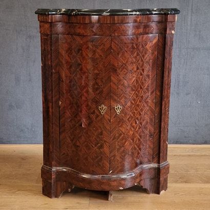 Louis XV-era corner cabinet with an ornate...