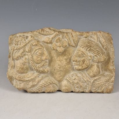 Stone FRAGMENT decorated with a relief depicting...