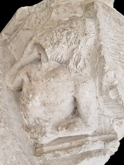 Carved limestone CULOT featuring a bust of...